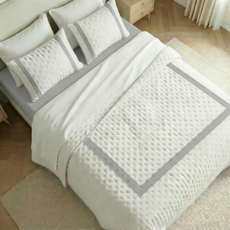 Colcha boutí estampada Portixol Plateado tacto suave