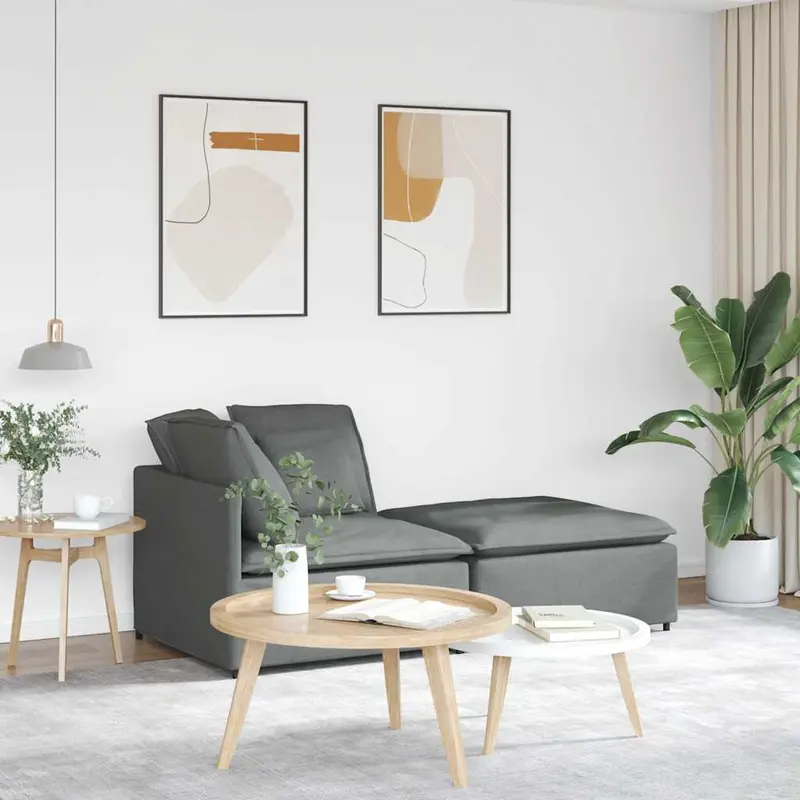 Sofá modular con reposapiés y cojines de tela gris oscuro